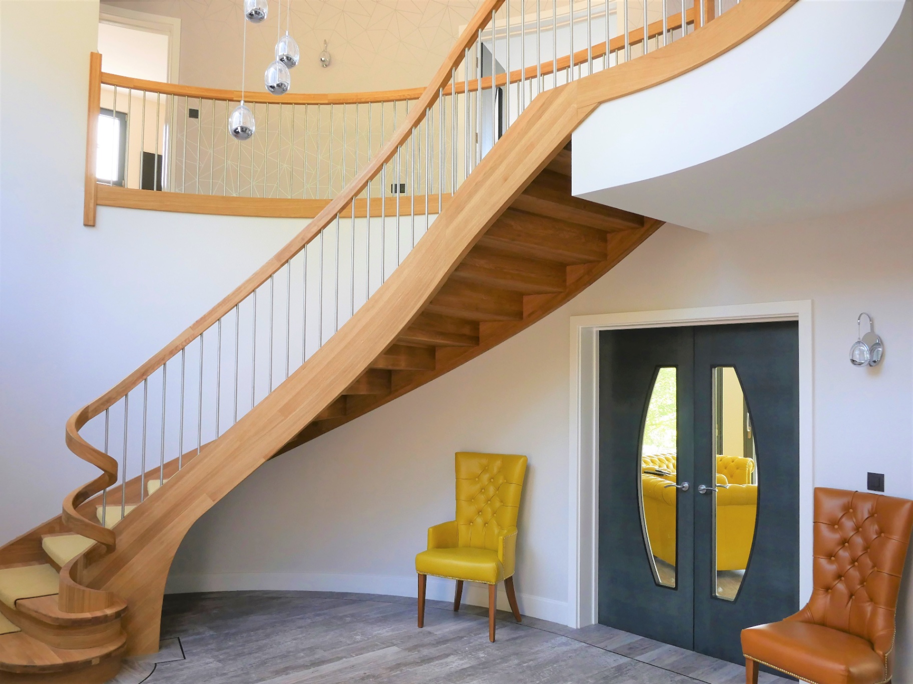 Sculptural curved oak staircase in a contemporary new build