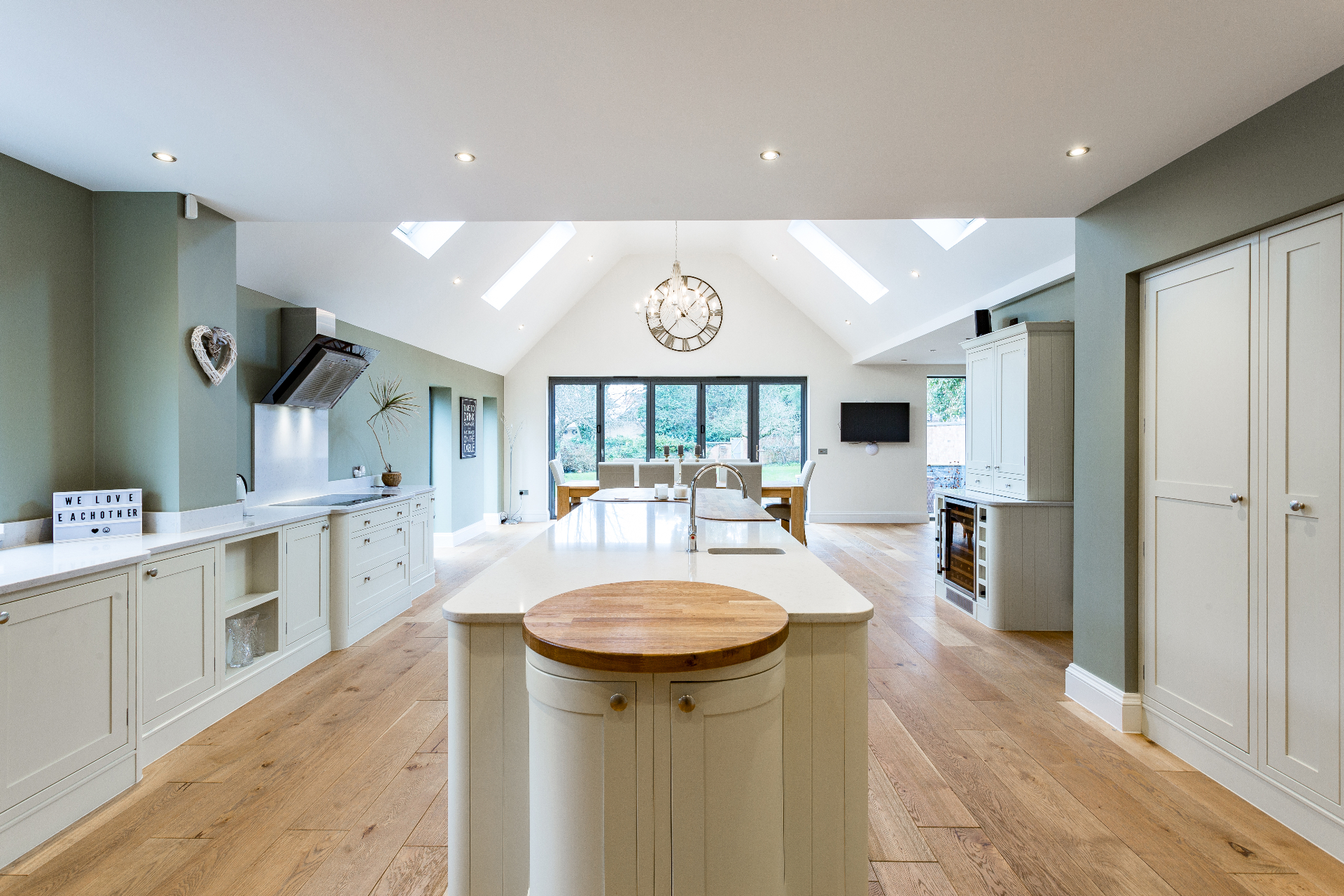 Open-plan vaulted kitchen and dining space with bifold doors to the garden