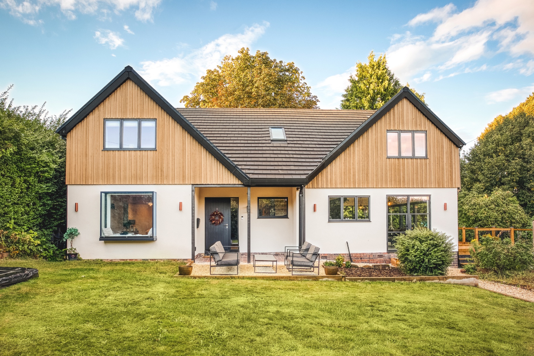 Timber-clad twin-gable new build home with contemporary detailing