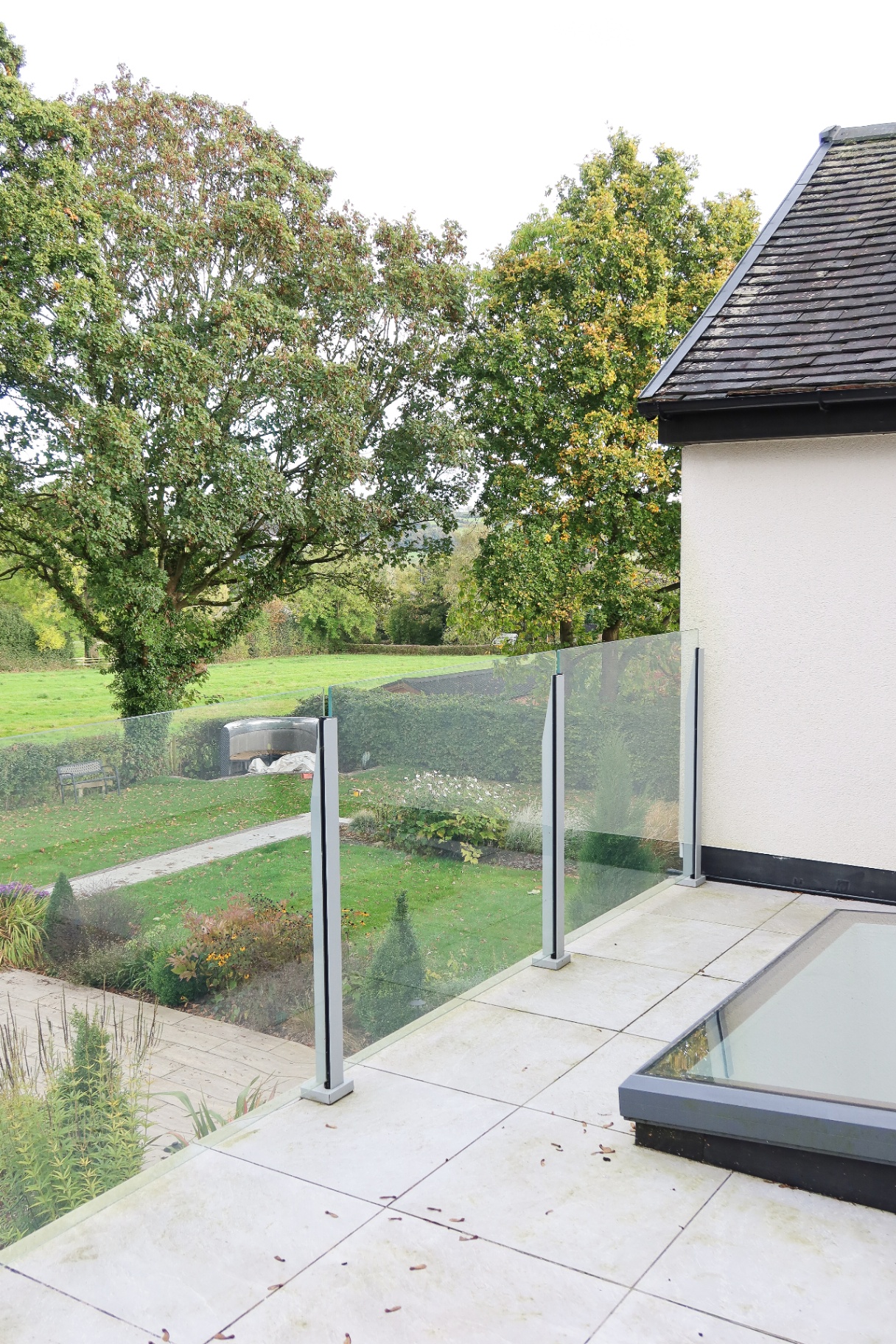 View from the glazed balcony across the garden to the Derbyshire countryside beyond