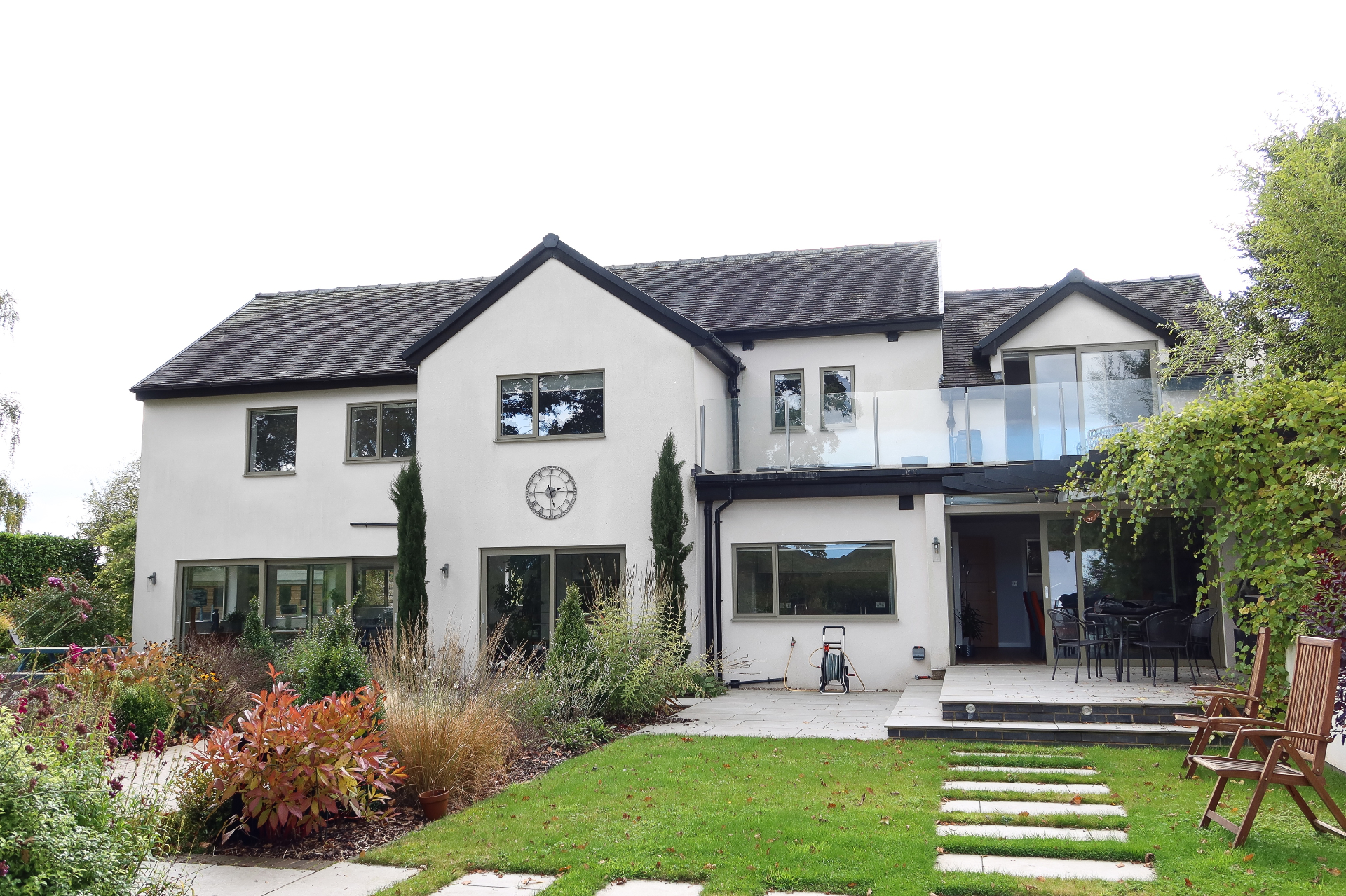 Rear elevation of the remodelled Richmond home with first floor glazed balcony